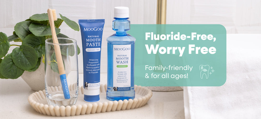 MooGoo mouthwash, toothpaste, and toothbrush on a bathroom counter. Fluoride-Free, Worry Free. Family-friendly and for all ages. 