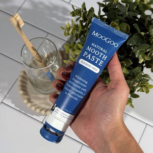 MooGoo Natural Moothpaste whitening peppermint toothpaste in bathroom, fluoride-free toothpaste with hydroxyapatite for dental health