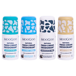 Four MooGoo Natural Fresh Cream Deodorant roll-on bottles lined up on a white background. The bottles feature cow-print caps in blue and beige, and labels for Lemon Myrtle, Coconut Cream, Fragrance-Free, and Oats & Honey. 100% aluminium free. 