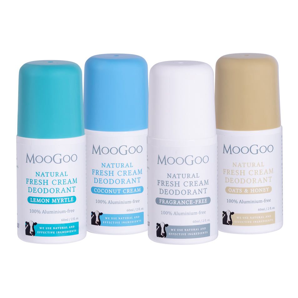 Four bottles of MooGoo natural deodorant on a white background