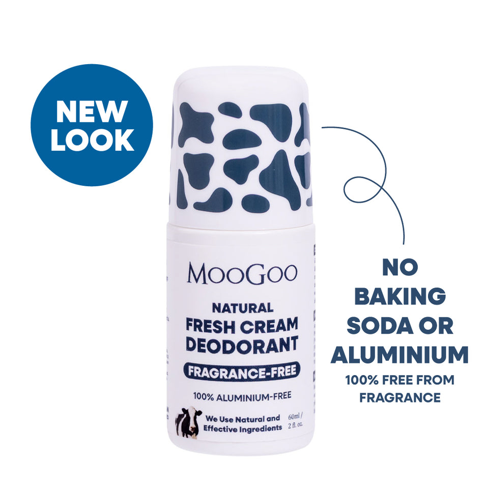 MooGoo Natural Fresh Cream Deodorant roll-on bottle with a white body and dark blue cow-print cap, shown on a white background with blue promotional text and a blue 'NEW LOOK' badge. Aluminium, baking soda and fragrance free deodorant for delicate underarms. 