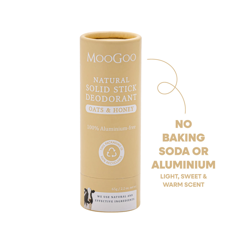 MooGoo Natural Solid Stick Deodorant in Oats & Honey scent, shown in its beige cardboard packaging tube on a white background. No baking soda or aluminium.