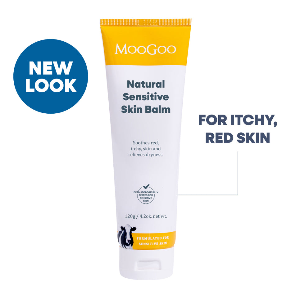 MooGoo Natural Sensitive Skin Balm in a white squeeze tube with yellow accents, shown on a white background. Gentle cream for red itchy irritated skin.