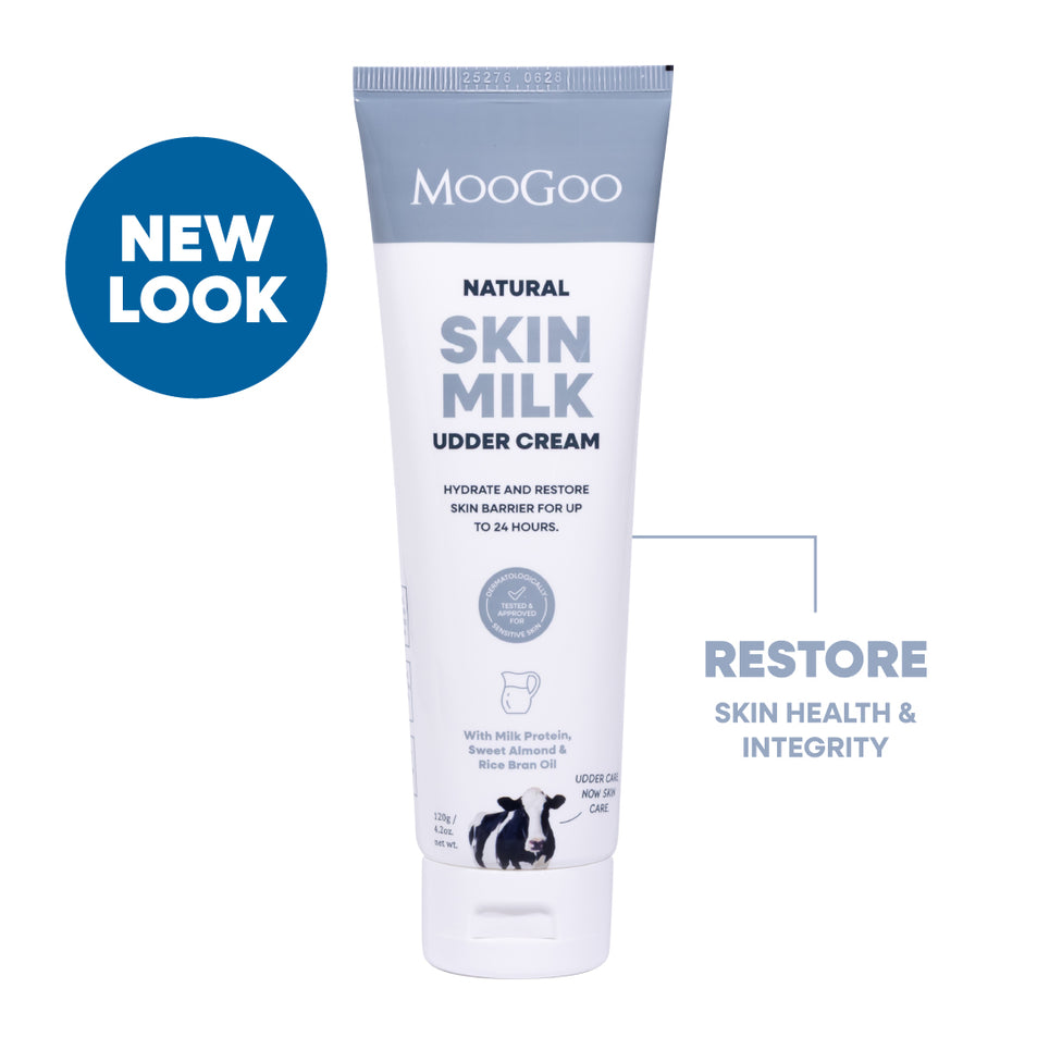 MooGoo Natural Skin Milk Udder Cream tube on a white background with a blue 'NEW LOOK' badge. Natural restorative moisturiser with aloe vera and vitamin E for dry, sensitive or damaged skin.